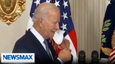 Biden coughs right into hand after taking mask off